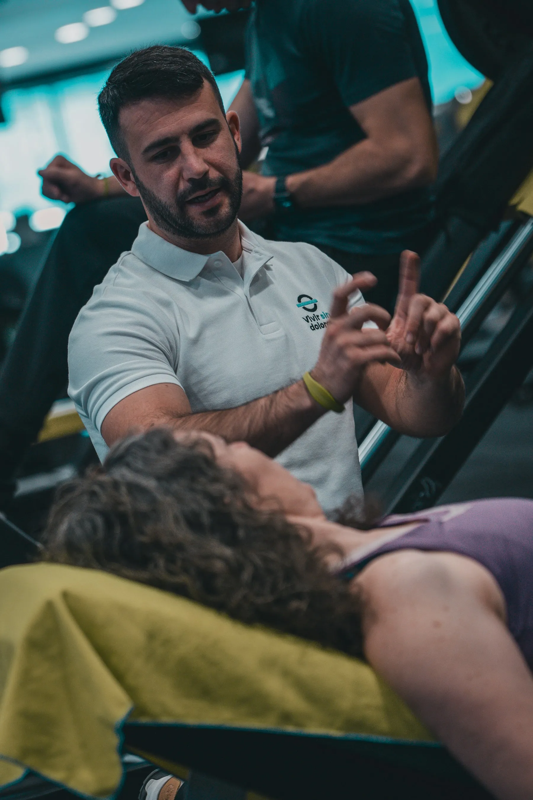 Alex coaching a client during a gym session